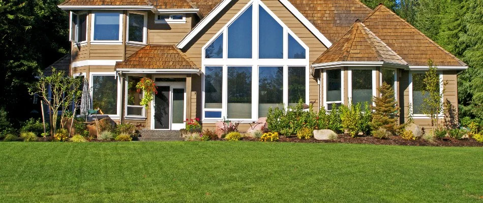 House in Longmont, CO, with lush grass and vibrant landscape.