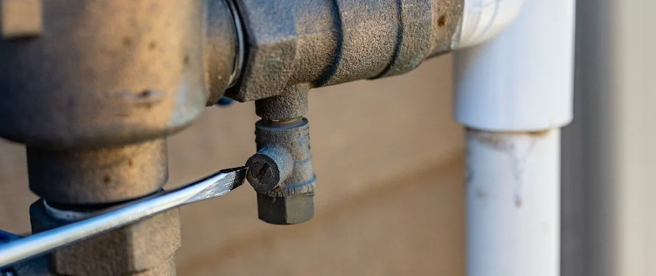 Turning on the water supply for an irrigation system in Longmont, CO.