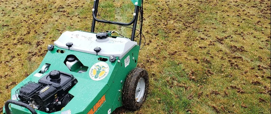 Lawn in Longmont, CO, with an aerator machine after aeration.