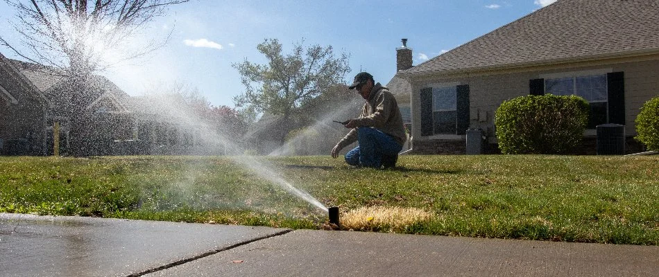 Irrigation pro working on a sprinkler irrigation system in Longmont, CO.