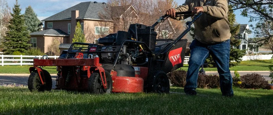 Professional mowing a lawn in Firestone, CO.