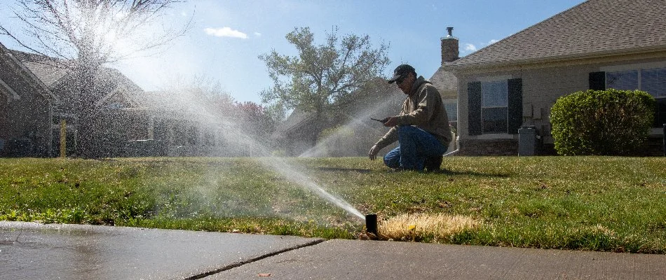 Tech working on an irrigation system in Firestone, CO.
